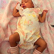 Goddess joined the competition — help win amazing prizes! newborn, baby, sleeping, infant, blanket, floral_pattern, onesie, hat, bow, socks, striped_socks, soft_texture, cute, peaceful, resting, close_up, portrait, indoors, child, tiny