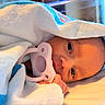 Goddess is registered to the contest to win money with this photo: newborn, baby, pacifier, blanket, hospital, infant, face, hand, wrapped, sleeping, cozy, closeup, cute, child, portrait, soft, skin, lying_down, young, resting