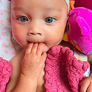 Kayora joined the competition — help win amazing prizes! baby, child, blue_eyes, headband, bow, blanket, pink_blanket, hand, fingers, plush_toy, bird_toy, face, portrait, cute, infant, closeup, indoors, soft_toy, sleeping_area, cozy