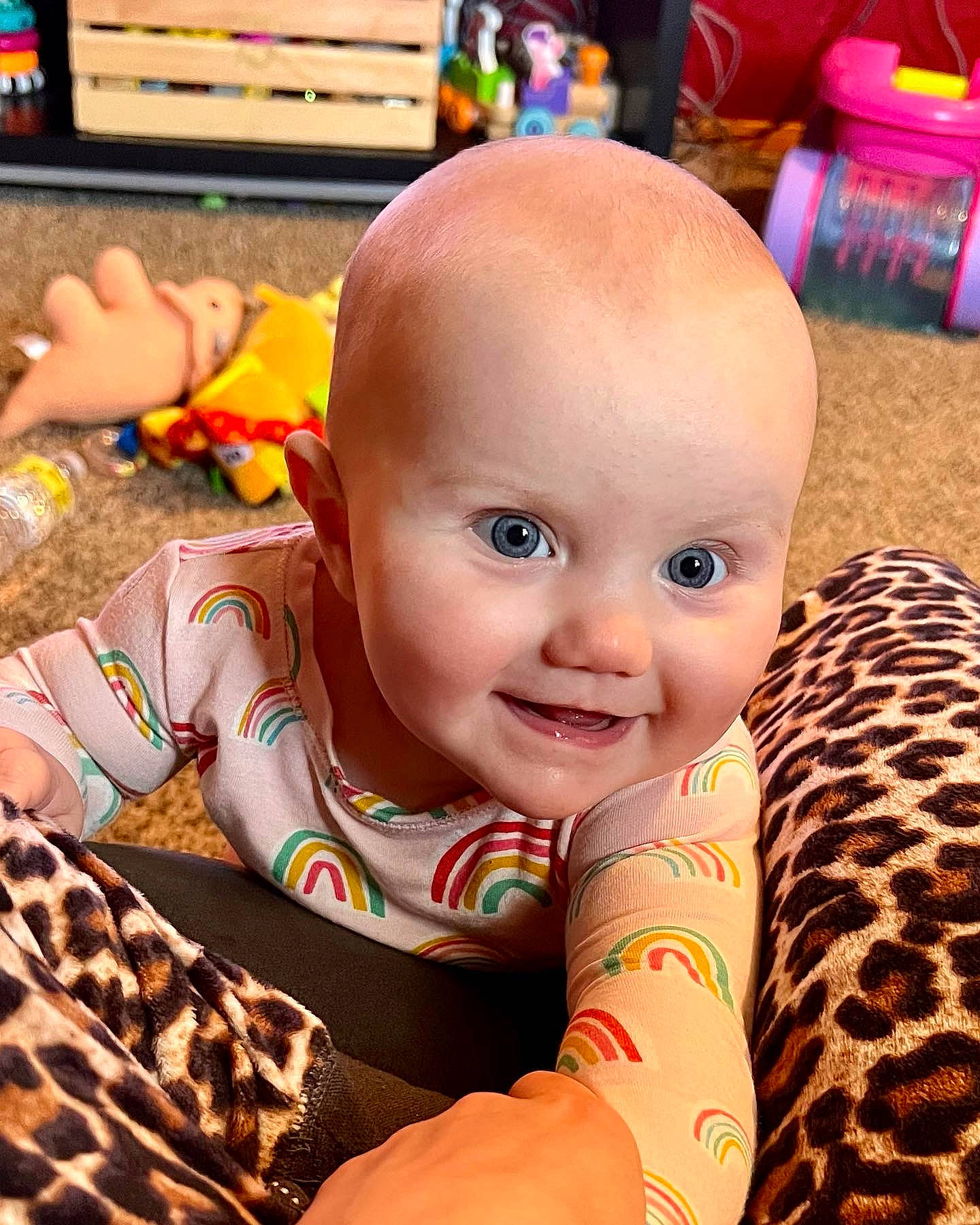 Brynley is registered to the contest to win money with this photo: arm, baby, cheek, child, comfort, eye, facial_expression, flooring, hairstyle, happy, head, iris, leisure, mouth, orange, person, product, skin, smile, toddler