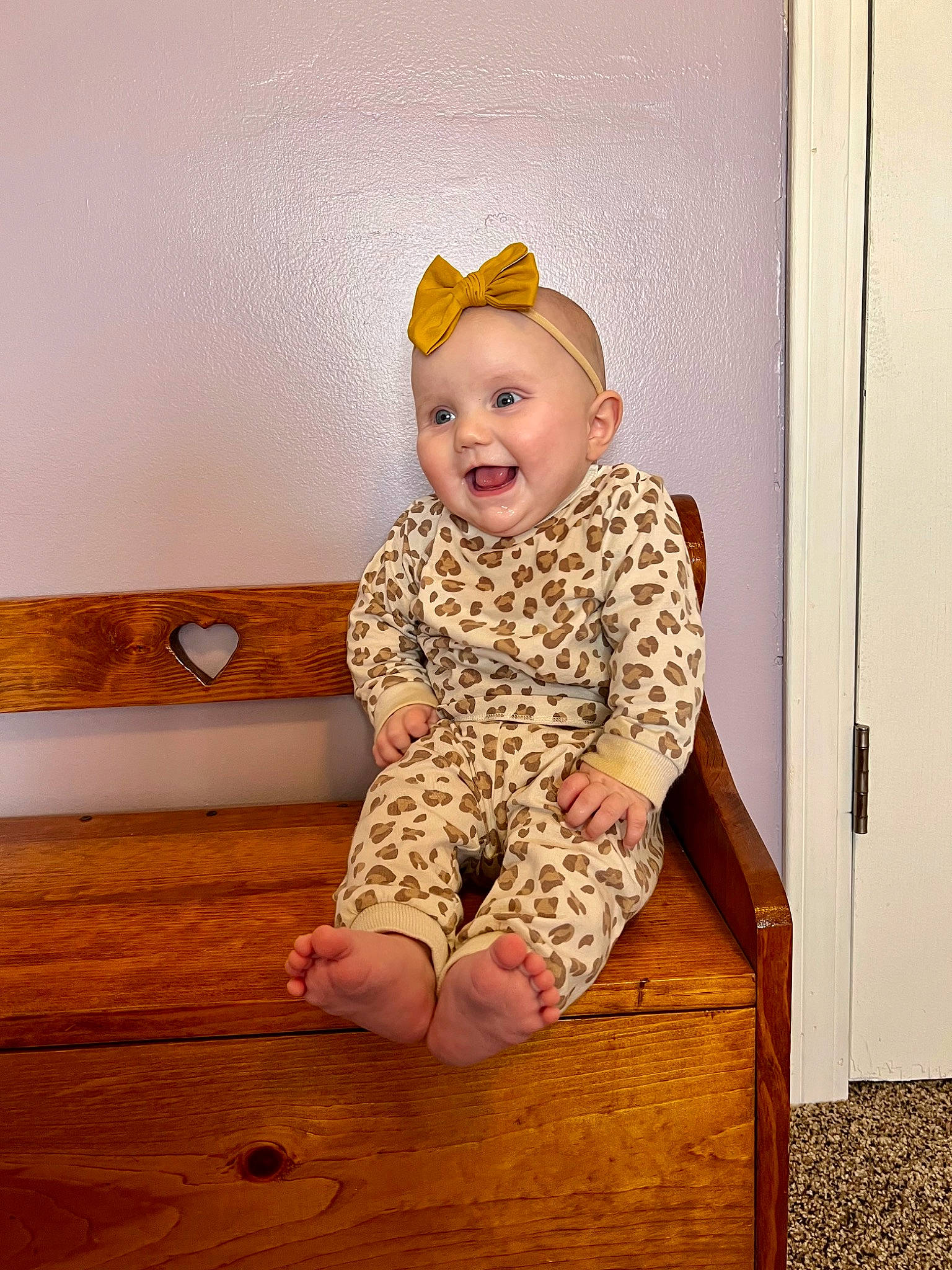 Brynley joined the competition — help win amazing prizes! baby_toddler_clothing, cap, child, comfort, door, dress, floor, flooring, fun, happy, hardwood, human_leg, knee, pattern, person, sitting, sleeve, smile, thigh, toddler