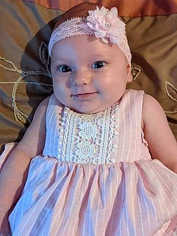 Elodie joined the competition — help win amazing prizes! baby, baby_toddler_clothing, cheek, child, child_model, costume_accessory, day_dress, dress, embellishment, hair_accessory, headband, headgear, headpiece, headwear, iris, pattern, person, pink, skin, textile