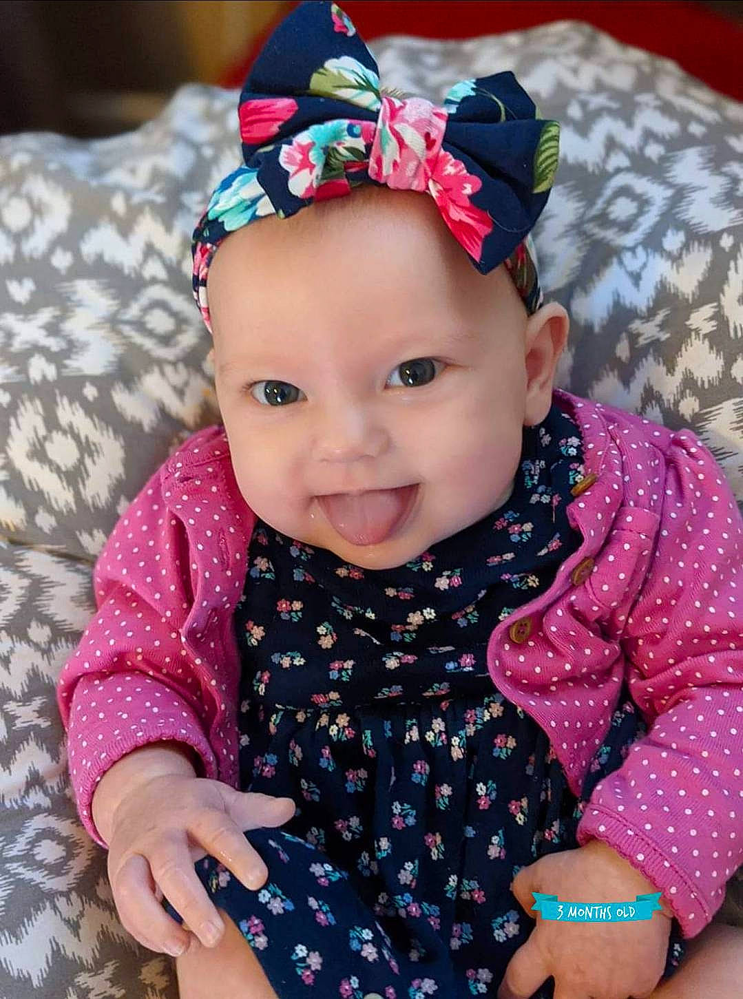 Elodie joined the competition — help win amazing prizes! baby, baby_toddler_clothing, bonnet, bracelet, cheek, child, costume_accessory, costume_hat, hair_accessory, hand, headgear, headpiece, headwear, mouth, nail, nose, pattern, person, pink, sleeve