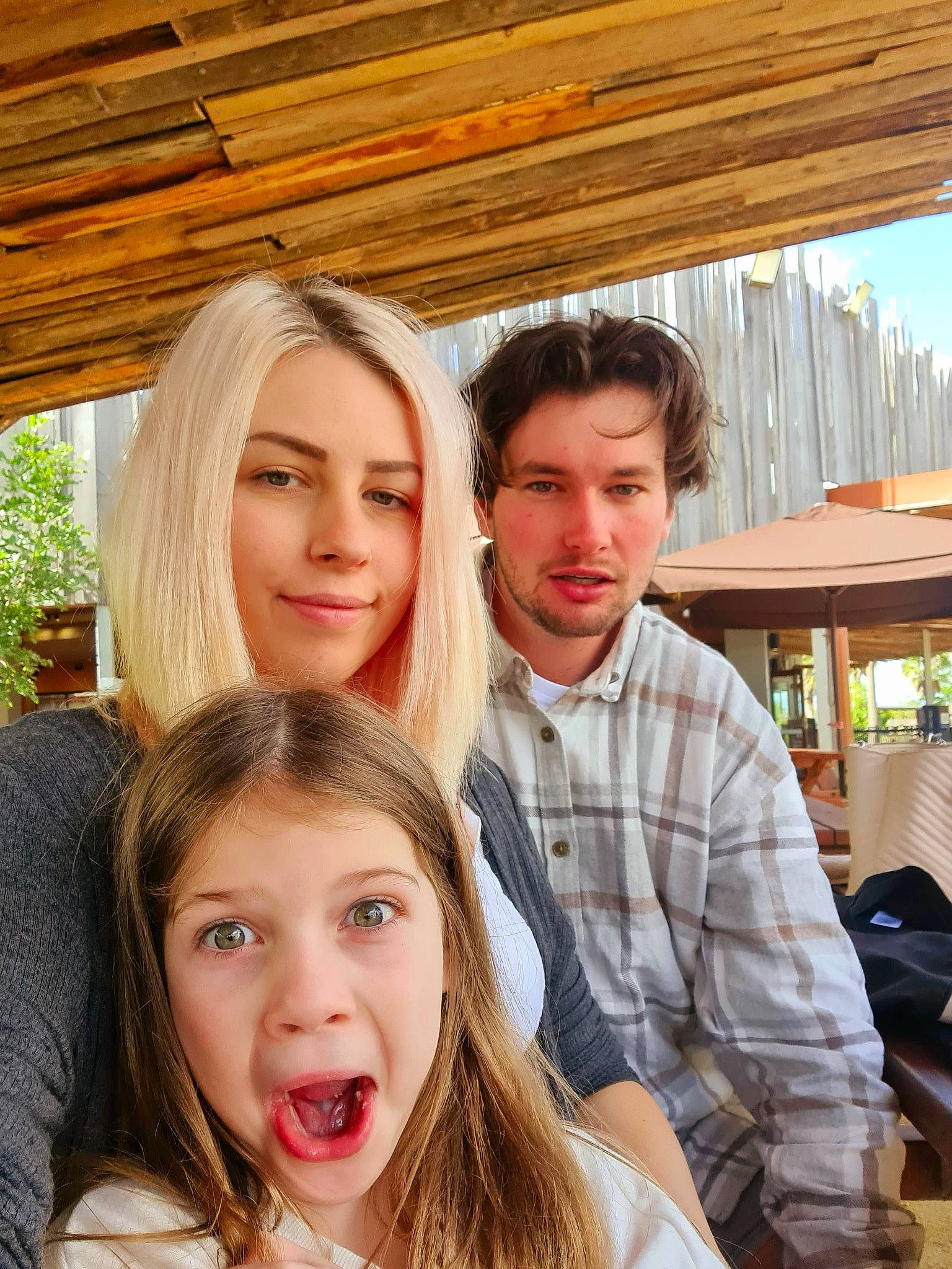 Indy is registered to the contest to win money with this photo: backpack, brown_hair, event, facial_expression, friendship, fun, happy, interaction, iris, jewellery, joy, leisure, lip, necklace, people, person, recreation, selfie, sitting, smile