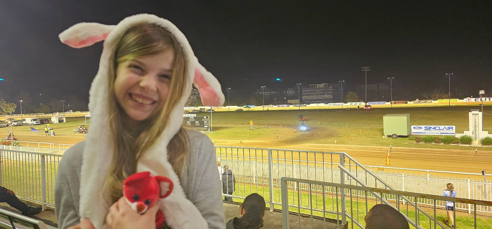 Indy joined the competition — help win amazing prizes! arena, competition_event, event, fan, fence, fun, gesture, grass, joy, leisure, night, organ, person, player, recreation, sky, smile, sport_venue, sports, stadium