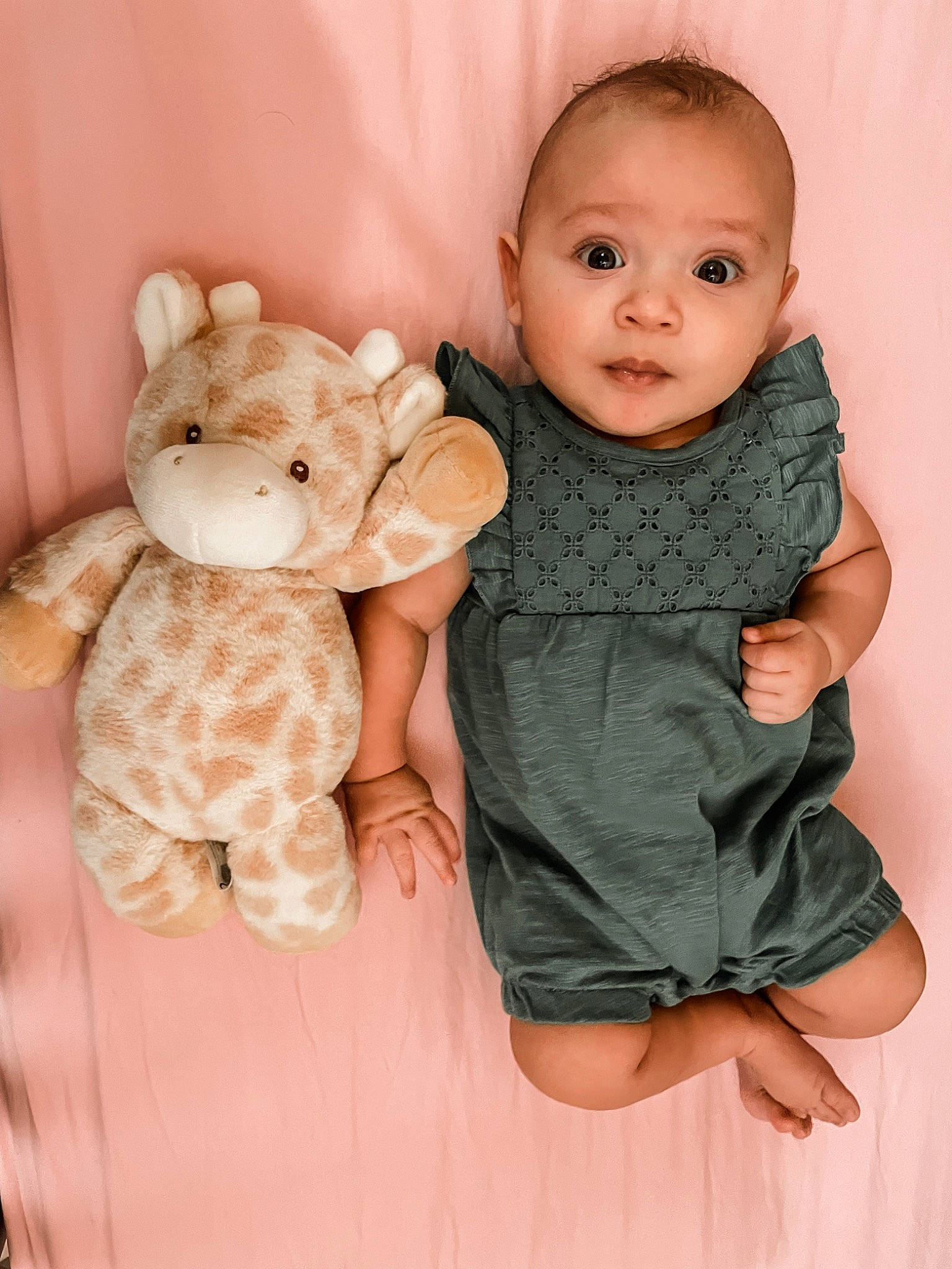 Aaliyah is registered to the contest to win money with this photo: arm, baby, baby_toddler_clothing, comfort, eye, fawn, finger, gesture, hand, head, human_body, joint, outerwear, person, pink, product, skin, sleeve, textile, thumb