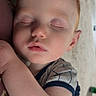 Ashton is registered to the contest to win money with this photo: baby, child, sleeping, red_hair, face, arm, blanket, clothing, infant, peaceful, resting, closeup, indoors, skin, eyelashes, nose, mouth, soft_light, portrait, toddler