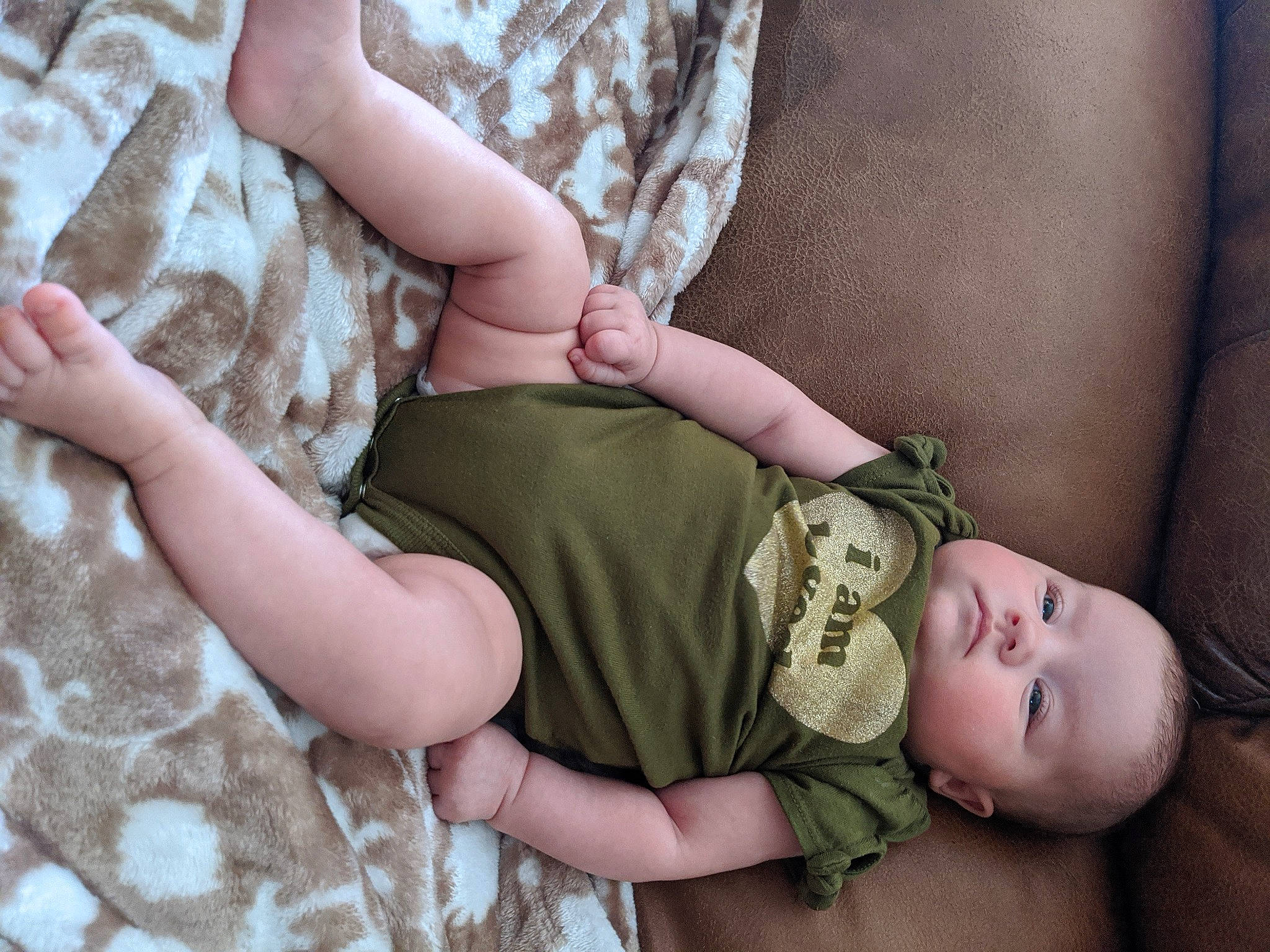 Driver is registered to the contest to win money with this photo: baby, camouflage, child, leg, person