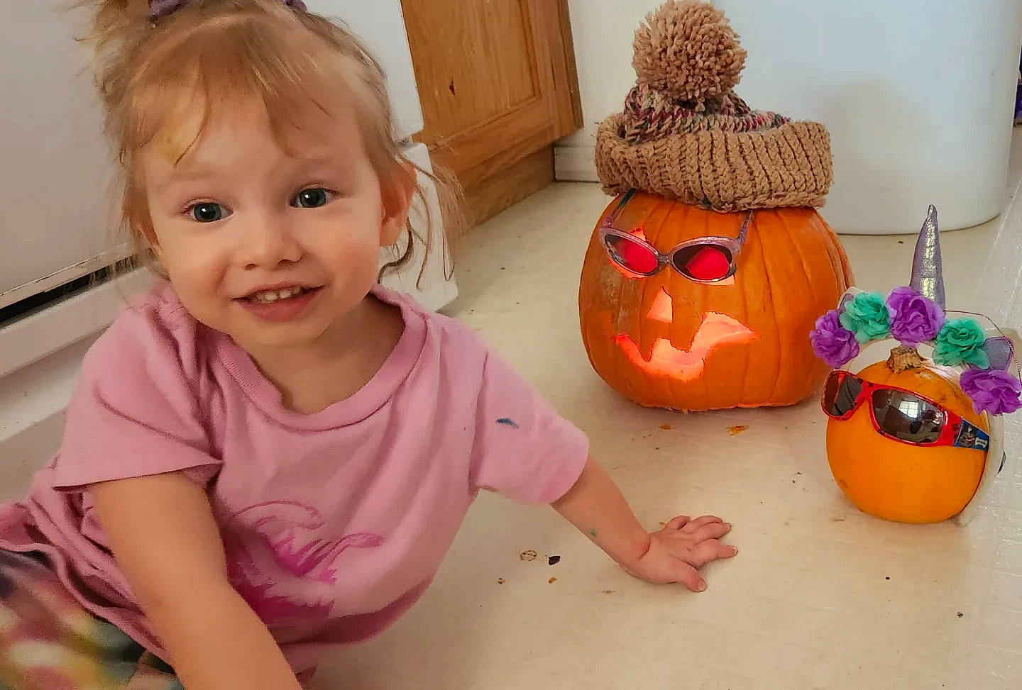 Clementine is registered to the contest to win money with this photo: baby, baby_toddler_clothing, calabaza, child, cucurbita, gourd, happy, hat, jack_o_lantern, joy, orange, person, plant, pumpkin, smile, squash, t_shirt, toddler, toy, vegetable