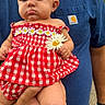 Kendall joined the competition — help win amazing prizes! baby, child, adult, blue_shirt, headband, flower, daisy, red_dress, checkered_pattern, outdoor, person, hand, legs, socks, summer, nature, portrait, cute, expression, holding