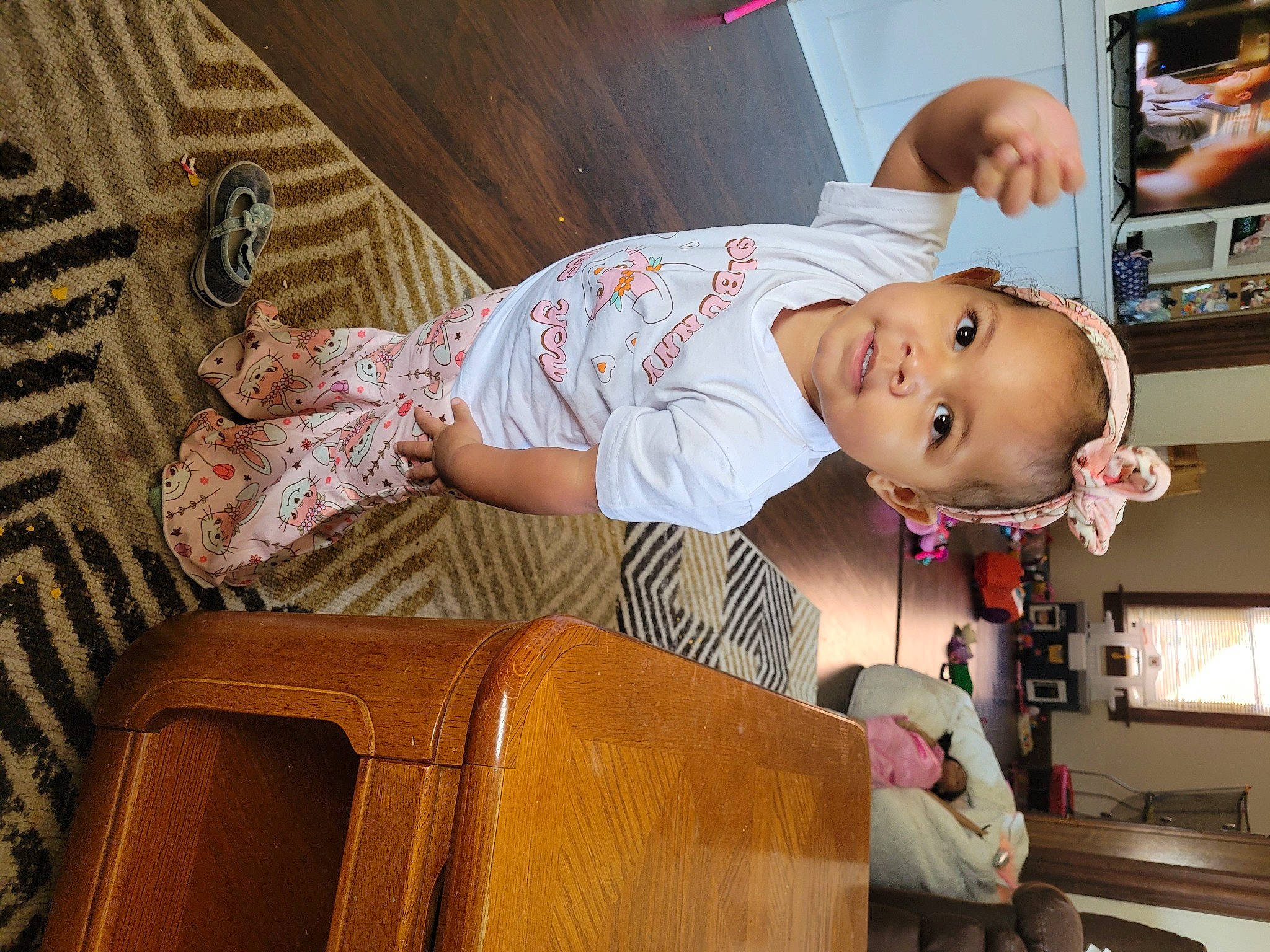 Heiress is registered to the contest to win money with this photo: baby, baby_products, baby_safety, baby_toddler_clothing, child, comfort, fun, happy, home_appliance, pattern, person, room, sitting, smile, toddler, wood