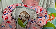 Nevaeh joined the competition — help win amazing prizes! baby, baby_gear, blanket, bouncer, child, colorful, elephant_design, eyes_open, face, indoors, infant, pajamas, pink_clothing, portrait, rainbow_pattern, serious_expression, sitting, sloth_toy, strawberry_pattern, textile