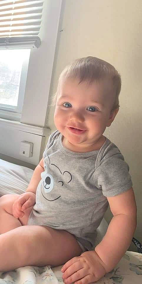 Jamey is registered to the contest to win money with this photo: arm, baby, cheek, child, chin, eye, face, facial_expression, finger, forehead, hand, head, joy, leg, lip, nose, person, sitting, skin, smile