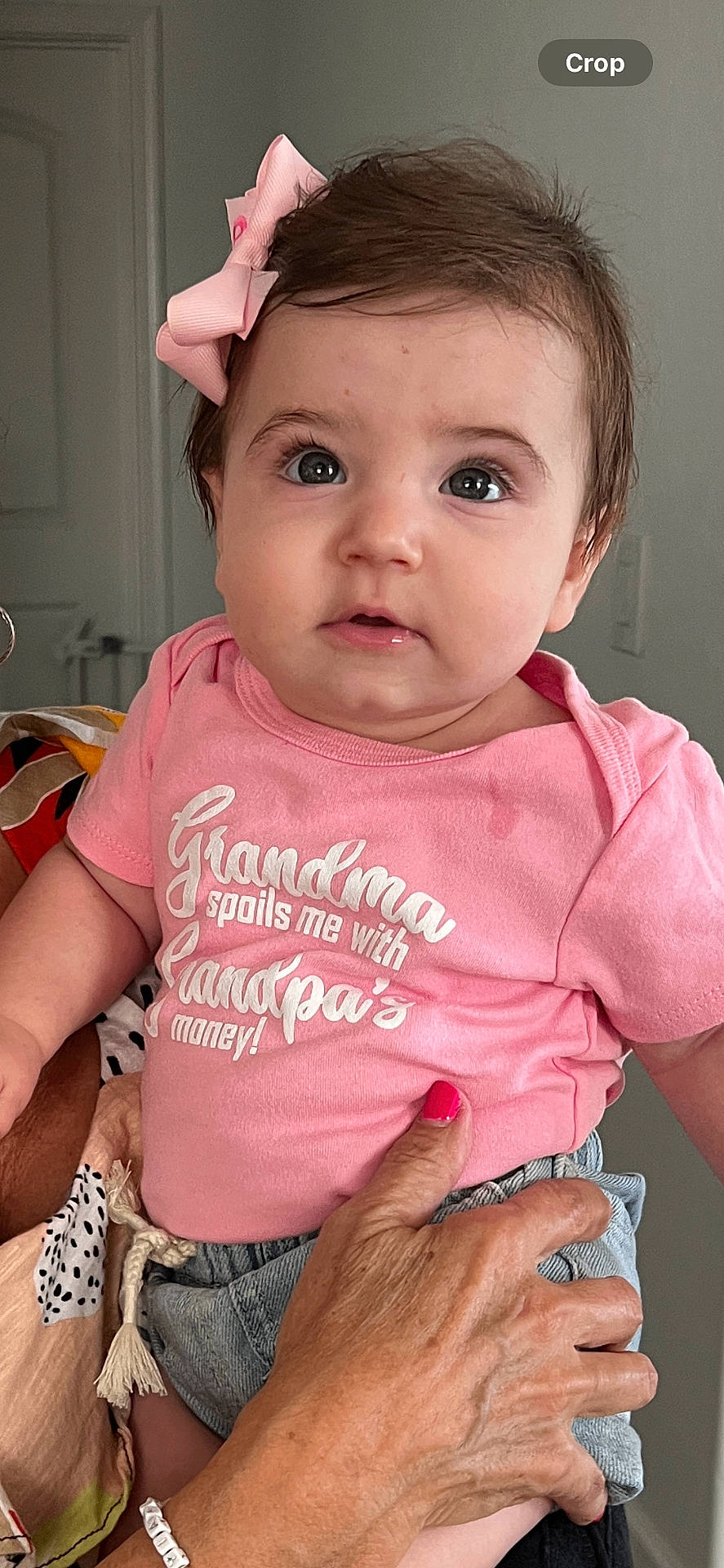 Christina is registered to the contest to win money with this photo: accessories, applique, baby, bodypart, clothing, face, finger, frown, hand, happy, head, jewelry, pants, pattern, person, photography, portrait, smile, t_shirt, wrist