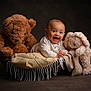 Ezra joined the competition — help win amazing prizes! baby, smiling, teddy_bear, stuffed_animal, basket, blanket, plush, cute, child, portrait, happy, soft_toys, indoor, cozy, infant, clothing, fabric, warm, skin, head