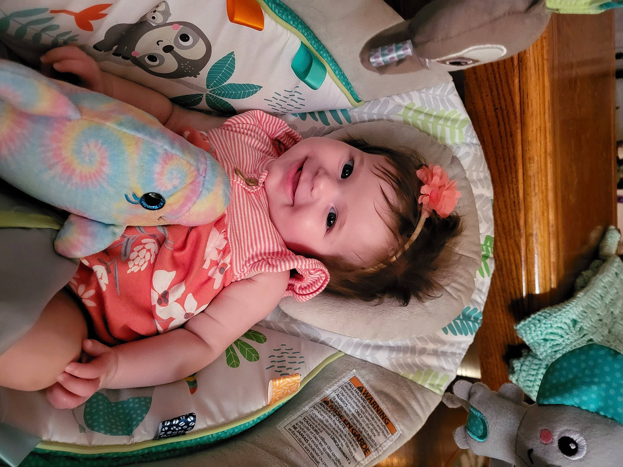Kenzlie is registered to the contest to win money with this photo: baby, baby_products, baby_toddler_clothing, cheek, child, comfort, facial_expression, fun, green, hairstyle, happy, head, human_body, joy, linens, mouth, person, pink, skin, smile