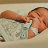 Zaiel joined the competition — help win amazing prizes! newborn, baby, infant, blanket, clothing, hospital_wristband, hand, face, lying_down, cute, soft, animal_print, bed, resting, young_child, portrait, skin, comfort, sleepy, cozy