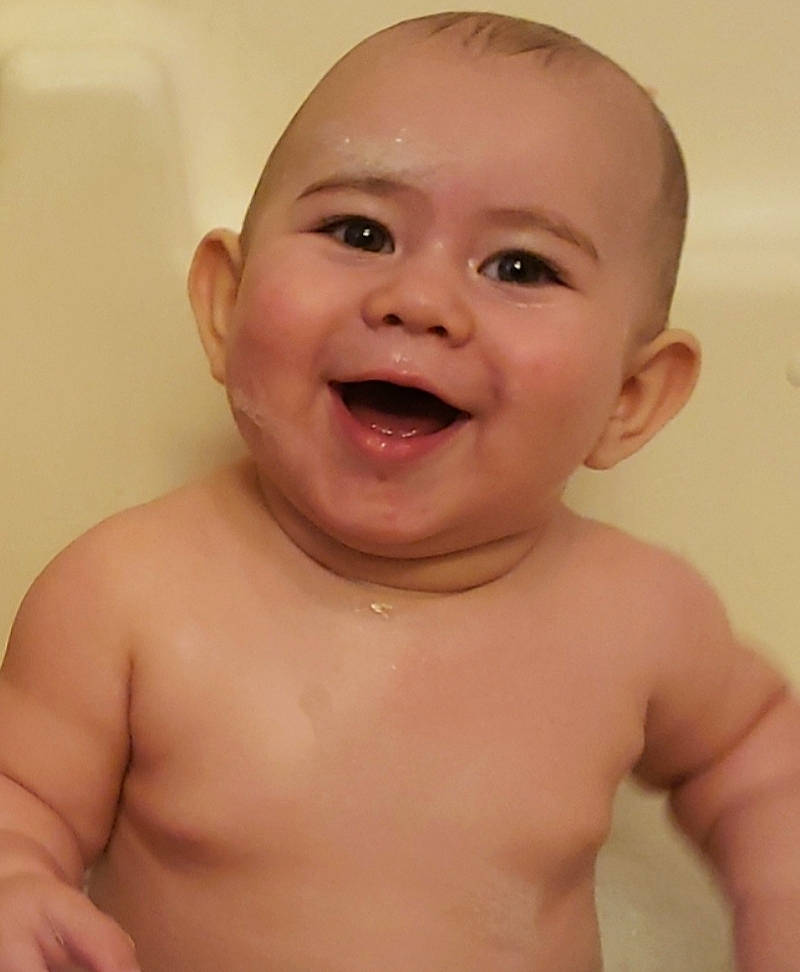 Jaden is registered to the contest to win money with this photo: baby, baby_bathing, baby_making_funny_faces, bathing, cheek, child, chin, close_up, eye, eyebrow, face, facial_expression, forehead, head, joy, lip, mouth, nose, person, skin