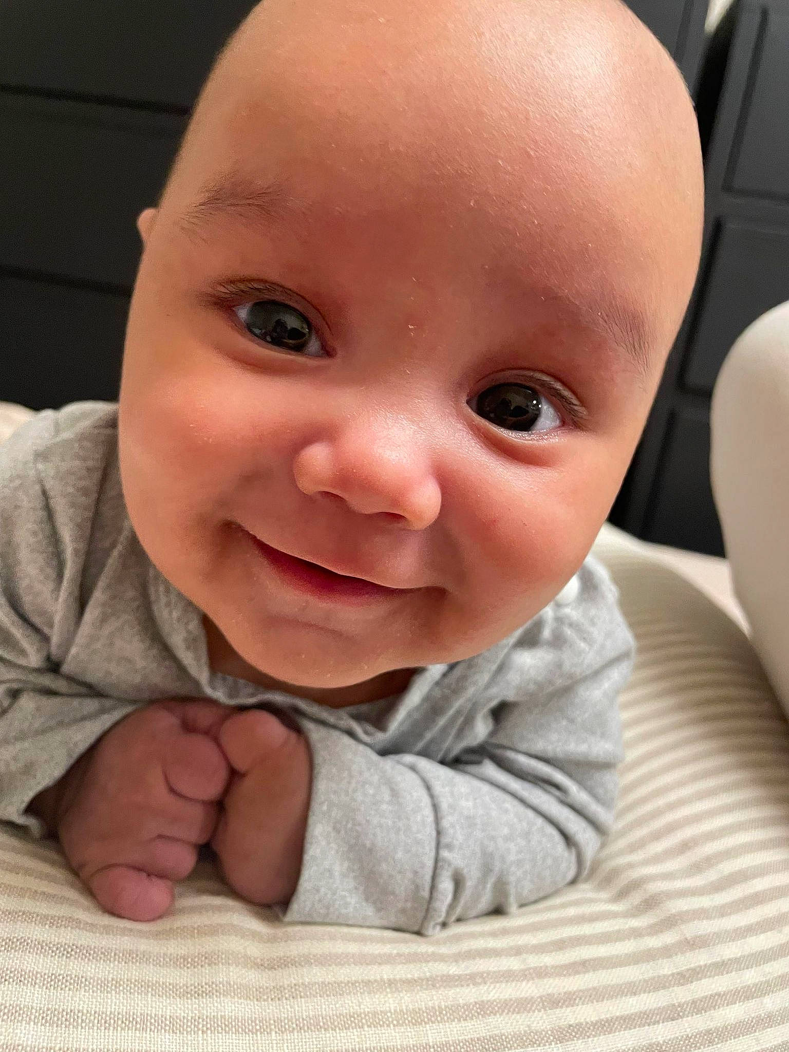 Jedidiah is registered to the contest to win money with this photo: baby, baby_toddler_clothing, cheek, chin, comfort, eye, eyebrow, eyelash, finger, gesture, happy, iris, lip, mouth, nose, person, skin, sleeve, smile, thumb