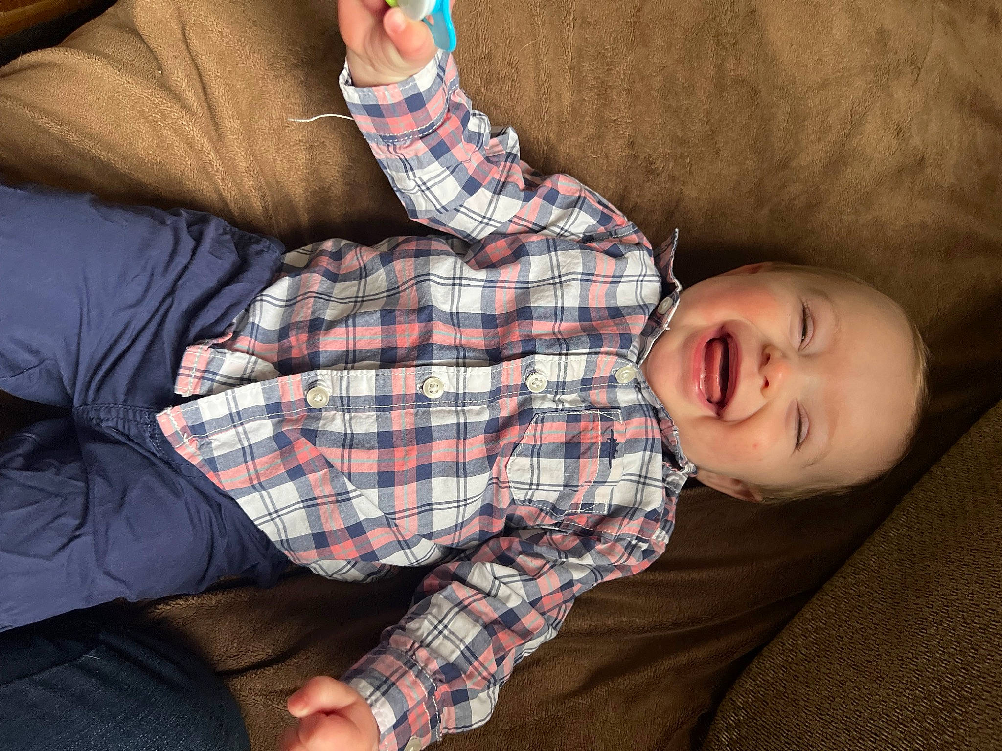 Chase joined the competition — help win amazing prizes! comfort, couch, dress, elbow, finger, glasses, human_body, human_leg, knee, pattern, person, plaid, skin, sleeve, smile, tartan, textile, thigh, toddler, tree