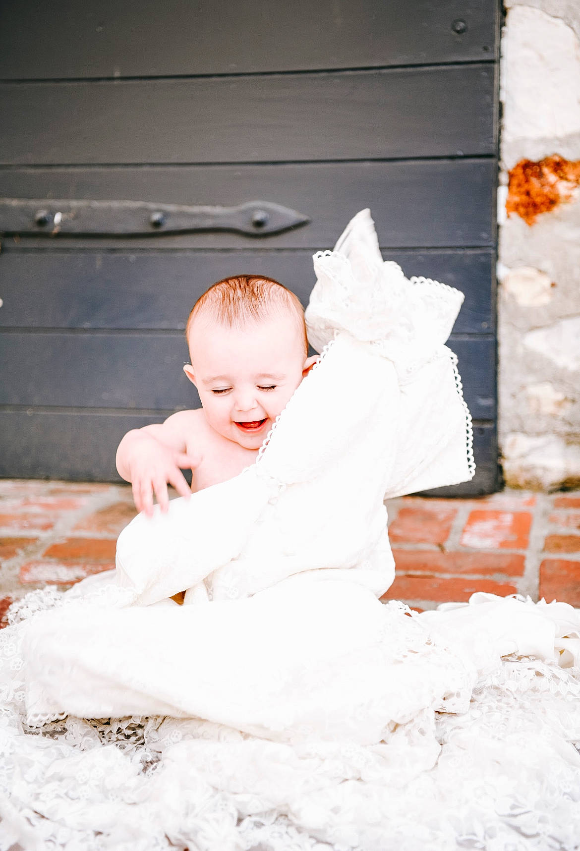 Emilia is registered to the contest to win money with this photo: baby, baby_toddler_clothing, bridal_clothing, child, dress, event, eye, flash_photography, floor, flooring, fun, fur, happy, joy, linens, person, portrait_photography, sitting, sleeve, smile