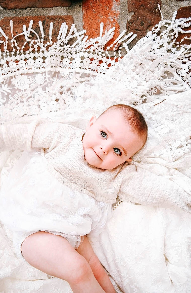 Emilia is registered to the contest to win money with this photo: baby, baby_toddler_clothing, beauty, child, embellishment, eye, fashion_accessory, flash_photography, fur, grass, hair_accessory, happy, natural_material, pattern, person, portrait_photography, sleeve, toddler, twig, winter
