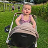 Amaya is registered to the contest to win money with this photo: baby, backyard, child, clouds, cornfield, family, farm, garden, grass, infant, lawn, outdoor, pink_clothing, portrait, sitting, sky, smiling, stroller, sunlight, trees