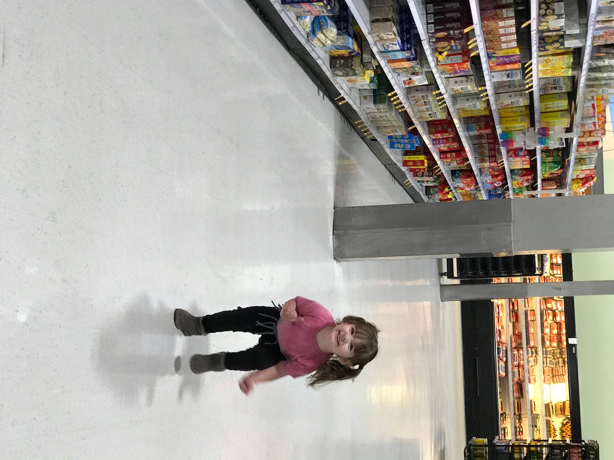 Katrina is registered to the contest to win money with this photo: bookcase, building, ceiling, cleanliness, collection, daylighting, flooring, fun, joy, line, magenta, person, product, publication, retail, room, shelf, shelving, stairs, visual_arts