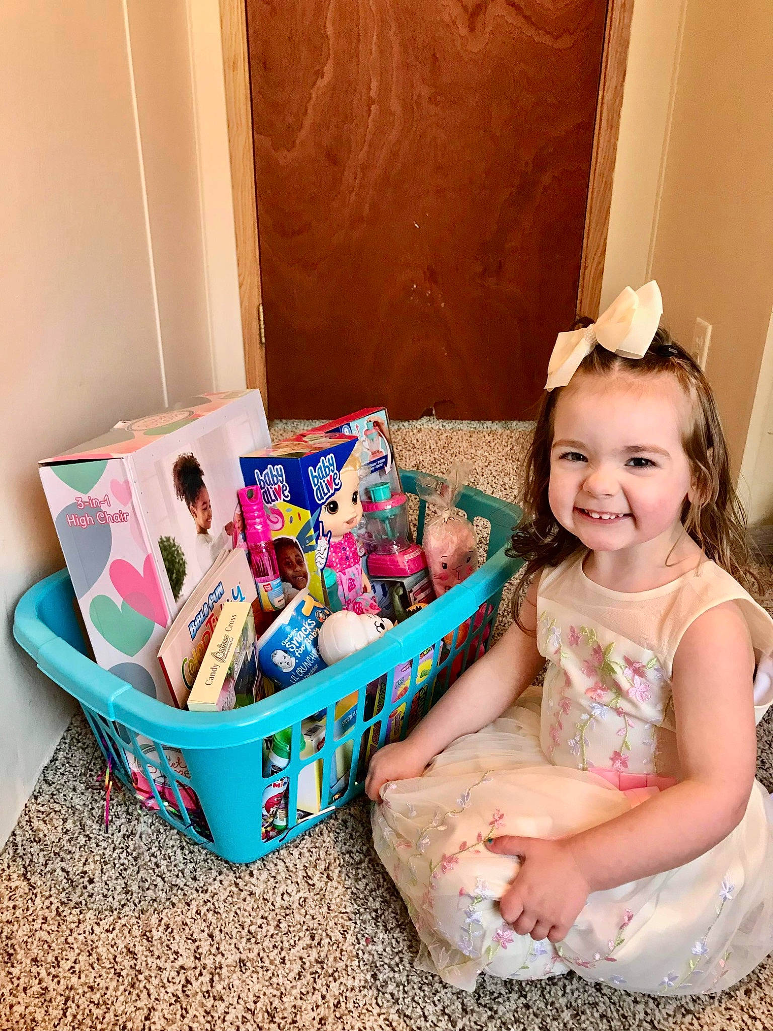 Katrina joined the competition — help win amazing prizes! baby_toddler_clothing, basket, box, carton, child, event, fashion_accessory, fun, happy, holiday, joy, magenta, packaging_and_labeling, party, party_supply, person, pink, present, sitting, smile