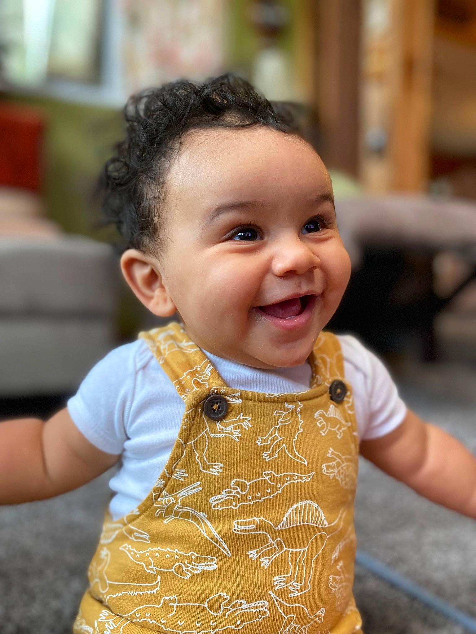 Santana joined the competition — help win amazing prizes! baby, baby_toddler_clothing, beauty, cheek, child, facial_expression, fun, hairstyle, happy, iris, joy, leisure, people, person, recreation, sitting, skin, sleeve, smile, t_shirt