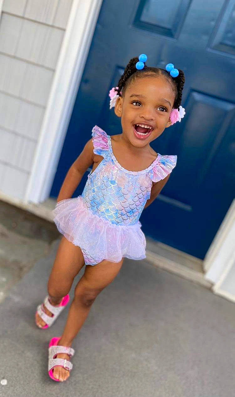 Kalena is registered to the contest to win money with this photo: baby_toddler_clothing, child, day_dress, electric_blue, face, facial_expression, flash_photography, fun, hairstyle, happy, human_leg, joy, leisure, magenta, person, pink, purple, sandal, smile, standing