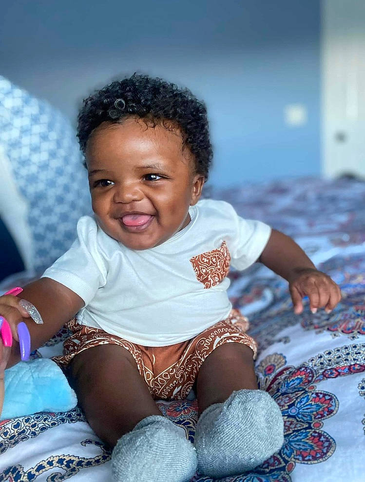 Kyngdom is registered to the contest to win money with this photo: arm, azure, baby, baby_toddler_clothing, black, blue, cheek, child, facial_expression, finger, flash_photography, fun, happy, iris, joy, people, person, pink, skin, sleeve