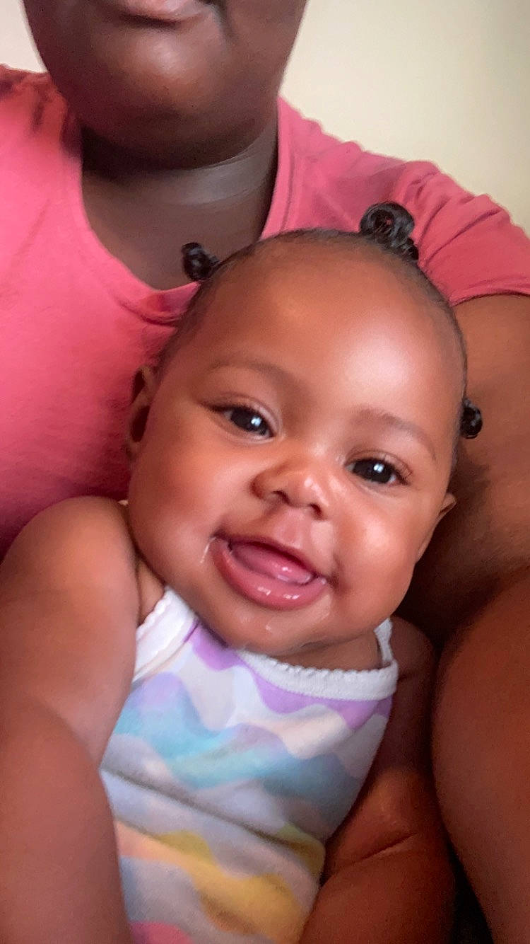 Journie is registered to the contest to win money with this photo: baby, cheek, ear, eyebrow, eyelash, finger, forehead, gesture, happy, interaction, iris, joy, lip, mouth, muscle, neck, nose, person, pink, shoulder