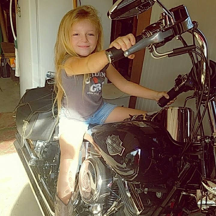 Regan joined the competition — help win amazing prizes! alloy_wheel, automotive_design, automotive_exterior, automotive_lighting, automotive_tire, automotive_wheel_system, classic, fender, fuel_tank, headlamp, hood, joy, motor_vehicle, motorcycle, motorcycle_accessories, person, rim, smile, spoke, tire