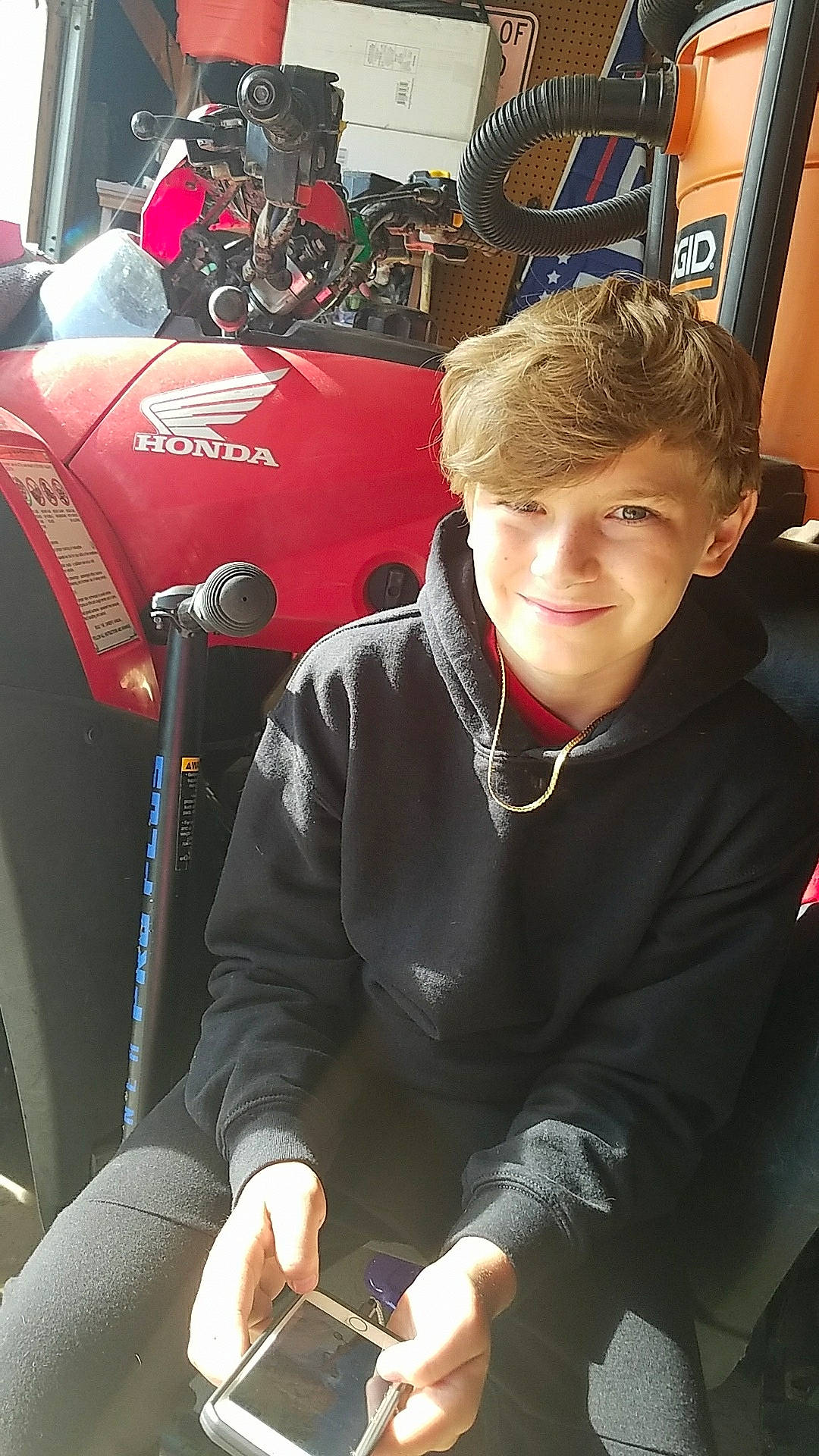 Dawson is registered to the contest to win money with this photo: auto_part, automotive_design, automotive_exterior, automotive_lighting, automotive_tire, automotive_wheel_system, engineering, eyewear, fender, joy, luxury_vehicle, motor_vehicle, motorcycle, person, personal_protective_equipment, race_car, recreation, smile, t_shirt, team