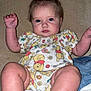 Kacelynn is registered to the contest to win money with this photo: baby, child, infant, onesie, winnie_the_pooh, bow, hair_accessory, cute, sitting, raised_hands, barefoot, blue_eyes, chubby_cheeks, indoor, blanket, clothing, person, portrait, soft_lighting, floor