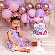 Sophia participe au concours pour gagner de l'argent avec cette photo : baby, balloons, birthday, cake, cake_smash, celebration, child, cute, decorations, dress, floor, flower_crown, frosting, happy, lavender, pink, portrait, purple, sitting, smiling