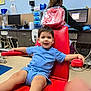 Zayne joined the competition — help win amazing prizes! child, smiling, blue_clothing, red_chair, medical_chair, healthcare_worker, computer, gloves, clinic, medical_equipment, desk, person, indoor, happy, short_hair, armrest, floor, cabinet, technology, monitor