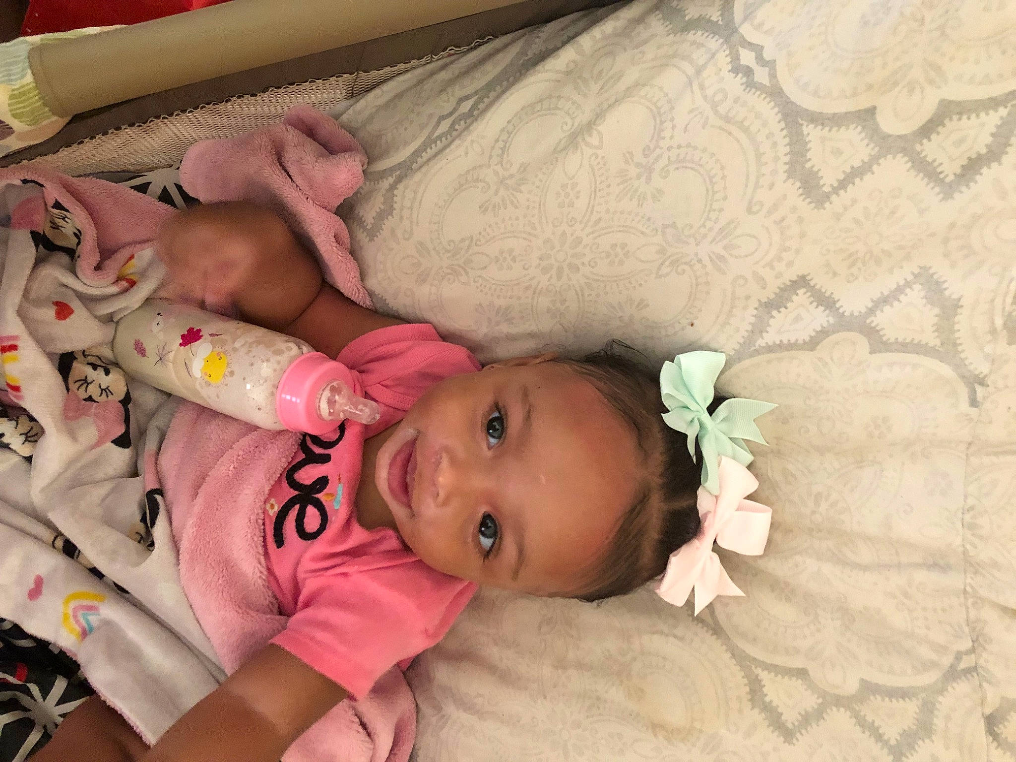 Neahmani is registered to the contest to win money with this photo: baby, baby_products, baby_safety, baby_toddler_clothing, bed, bedtime, cheek, comfort, flower, infant_bed, iris, linens, pattern, person, pink, product, room, skin, textile, toddler