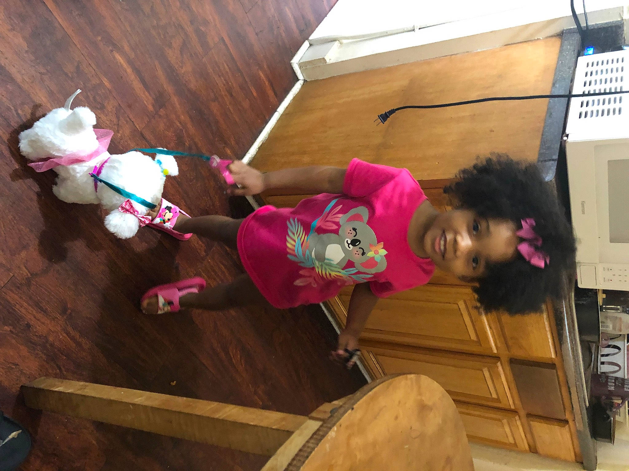 Egypt joined the competition — help win amazing prizes! baby_toys, child, companion_dog, flooring, fun, happy, hardwood, joy, leisure, magenta, person, pink, play, room, smile, stuffed_toy, tail, toddler, toy, wood