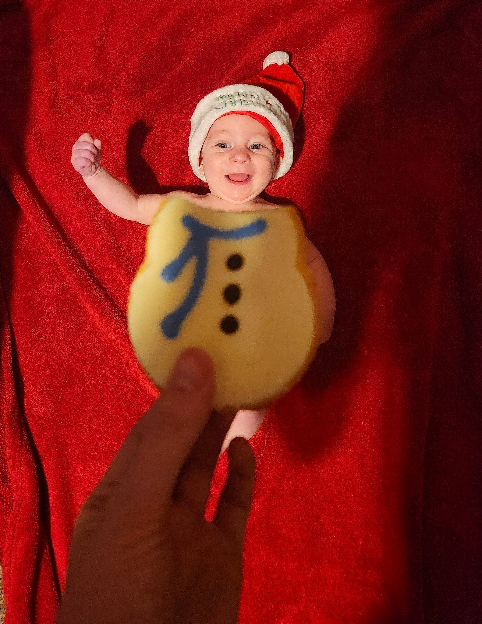 Jiraiya is registered to the contest to win money with this photo: baby, baby_toddler_clothing, cap, carmine, christmas_ornament, costume_hat, entertainment, event, face, finger, gesture, happy, head, headwear, performing_arts, person, sleeve, smile, t_shirt, thumb