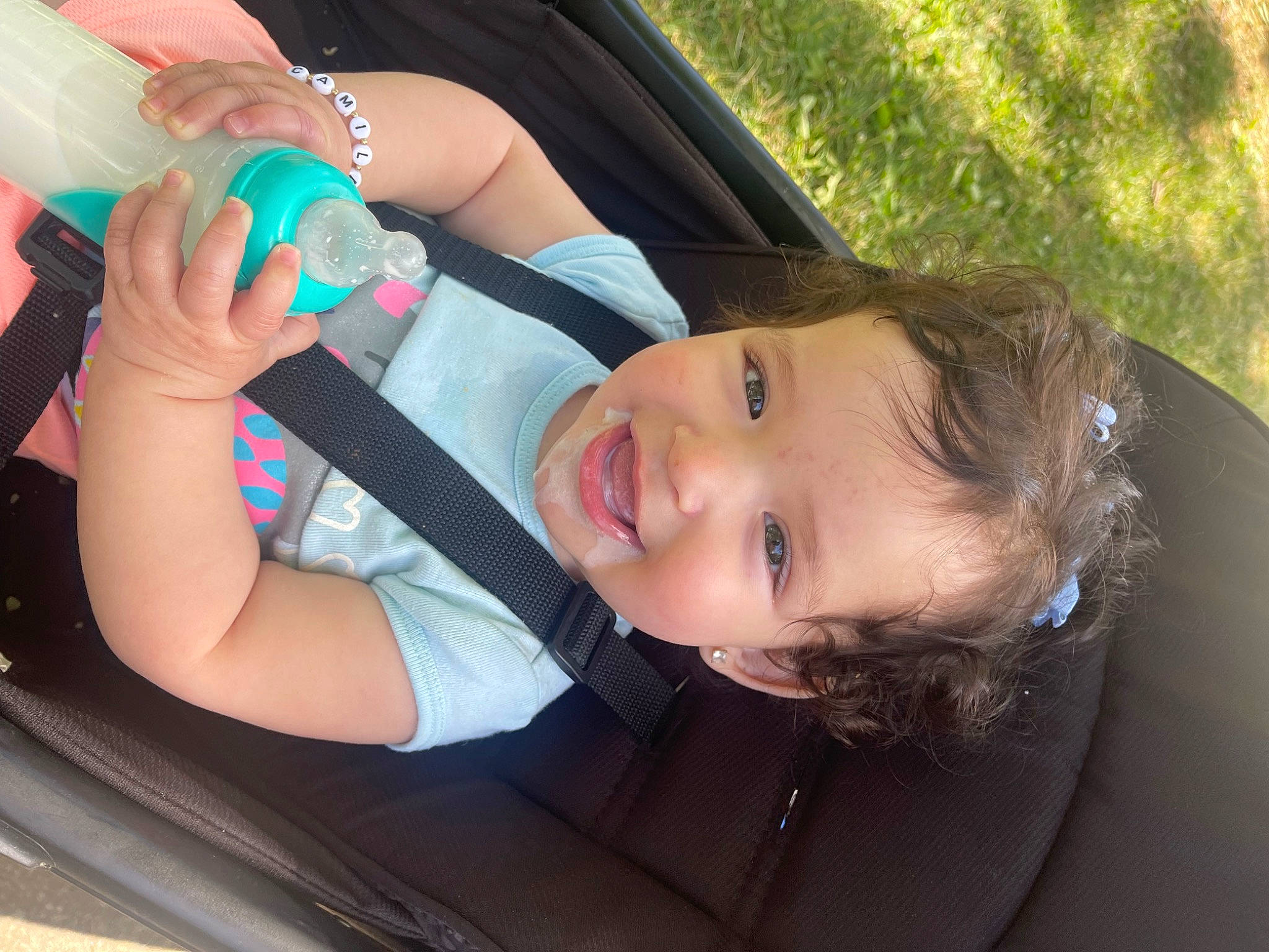 Camila joined the competition — help win amazing prizes! arm, car, dress, finger, fun, gesture, grass, hand, happy, human_body, leg, mammal, person, plant, skin, smile, toddler, tree, vehicle, vehicle_door