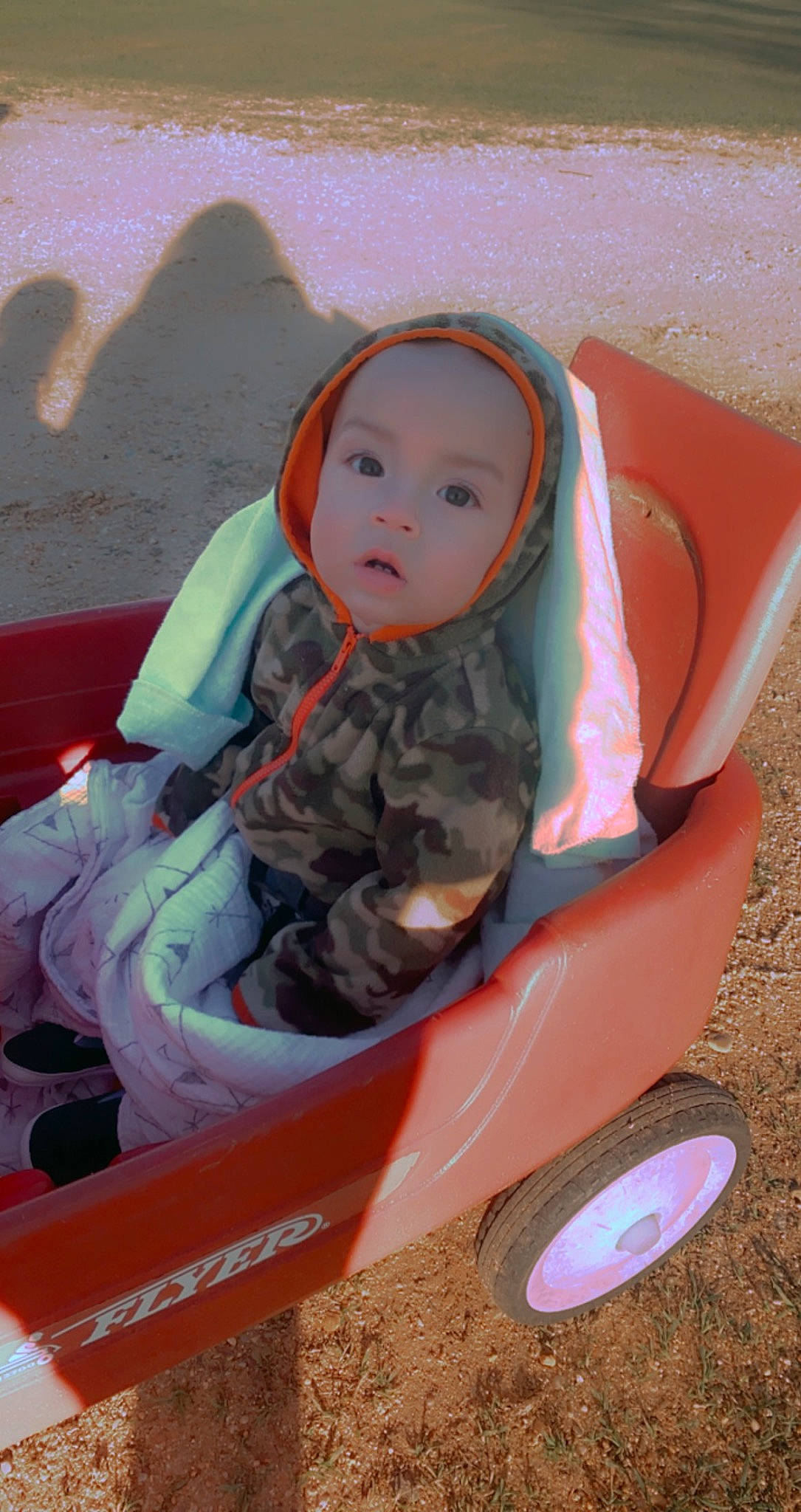 Justin is registered to the contest to win money with this photo: automotive_tire, baby, baby_carriage, baby_products, baby_toddler_clothing, beauty, child, comfort, fender, fun, headwear, motor_vehicle, person, pink, riding_toy, sitting, surprise, tire, toddler, wheel