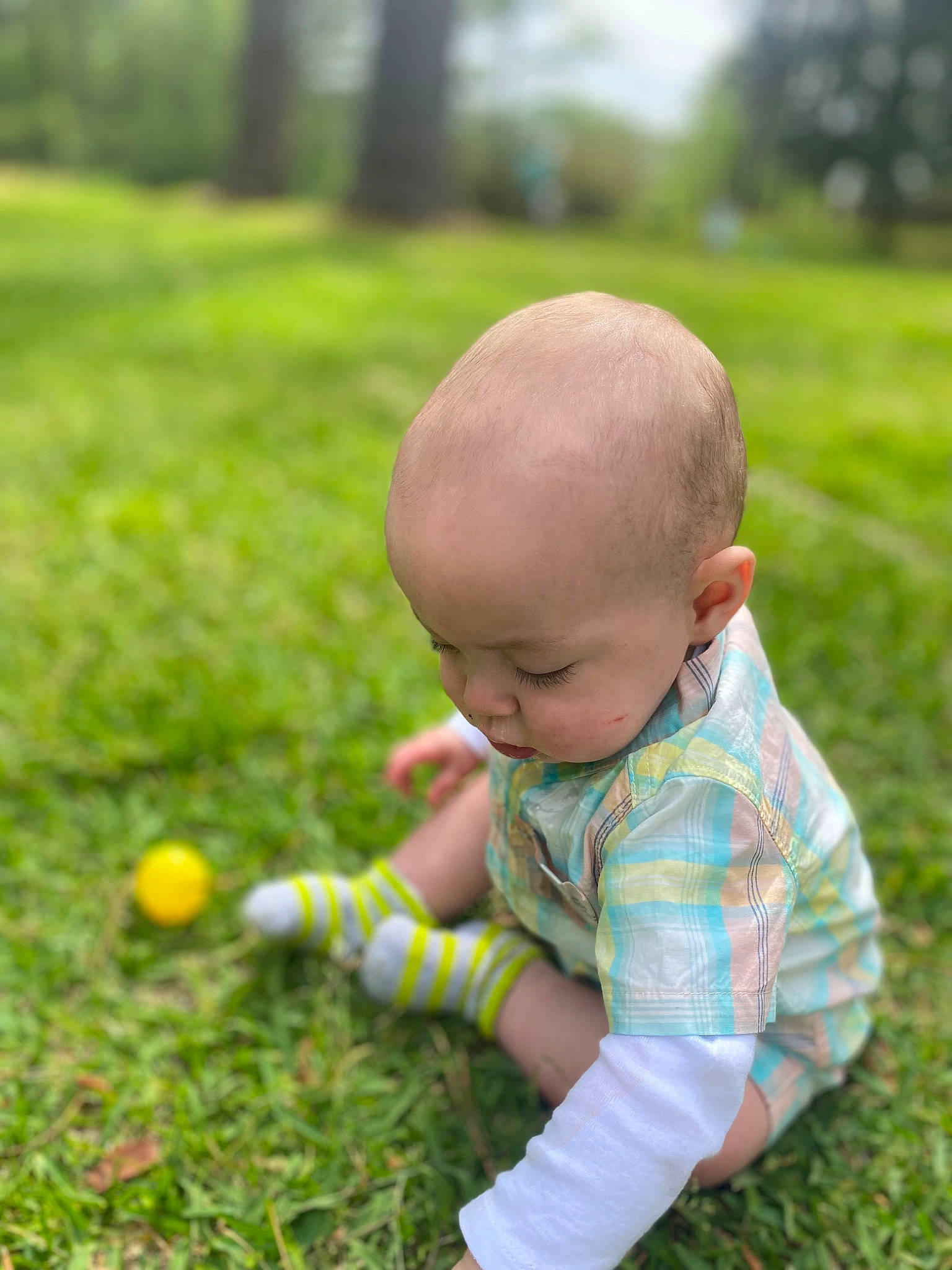 Dustin is registered to the contest to win money with this photo: baby, baby_toddler_clothing, ball, child, flooring, garden, grass, grass_family, grassland, groundcover, happy, lawn, leisure, meadow, people_in_nature, person, plant, recreation, sitting, toddler