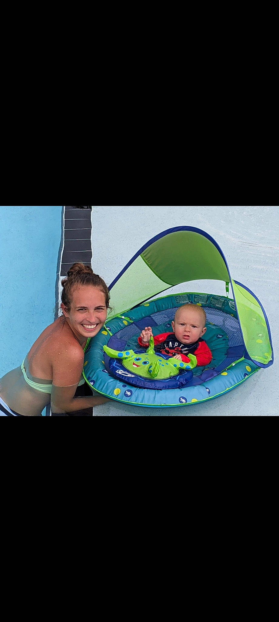 Tyson is registered to the contest to win money with this photo: baby, baby_carriage, baby_products, brassiere, child, circle, comfort, flash_photography, fun, happy, joy, leisure, magenta, person, personal_protective_equipment, recreation, sitting, skin, smile, swimming_pool