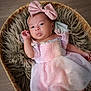 baby, infant, newborn, headband, bow, pink_dress, tulle, basket, faux_fur, soft_texture, portrait, hand, toes, gaze, cute, cozy, wooden_floor, indoor, sleepy, photography