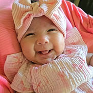 Cataleyah joined the competition — help win amazing prizes! baby, smiling, pink_bow, headband, cute, infant, tongue_out, pink_clothing, blanket, happy, closeup, portrait, child, soft_texture, indoors, cozy, adorable, baby_girl, cheerful, sleepwear