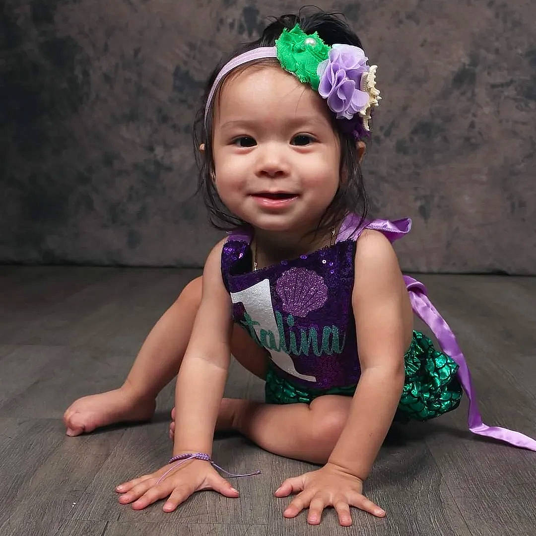 Catalina joined the competition — help win amazing prizes! baby, baby_toddler_clothing, child, eye, fashion_accessory, flower, grass, happy, head, headband, headpiece, headwear, iris, jewellery, joy, magenta, person, pink, plant, purple