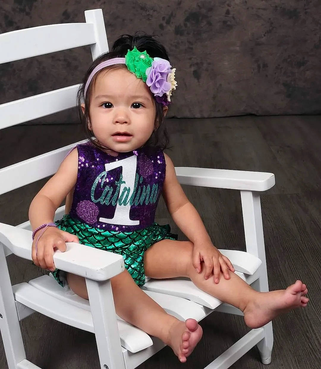 Catalina is registered to the contest to win money with this photo: baby, baby_toddler_clothing, chair, comfort, dress, event, fashion_accessory, fashion_design, fun, happy, headband, headpiece, headwear, human_leg, jewellery, magenta, person, pink, purple, sleeve