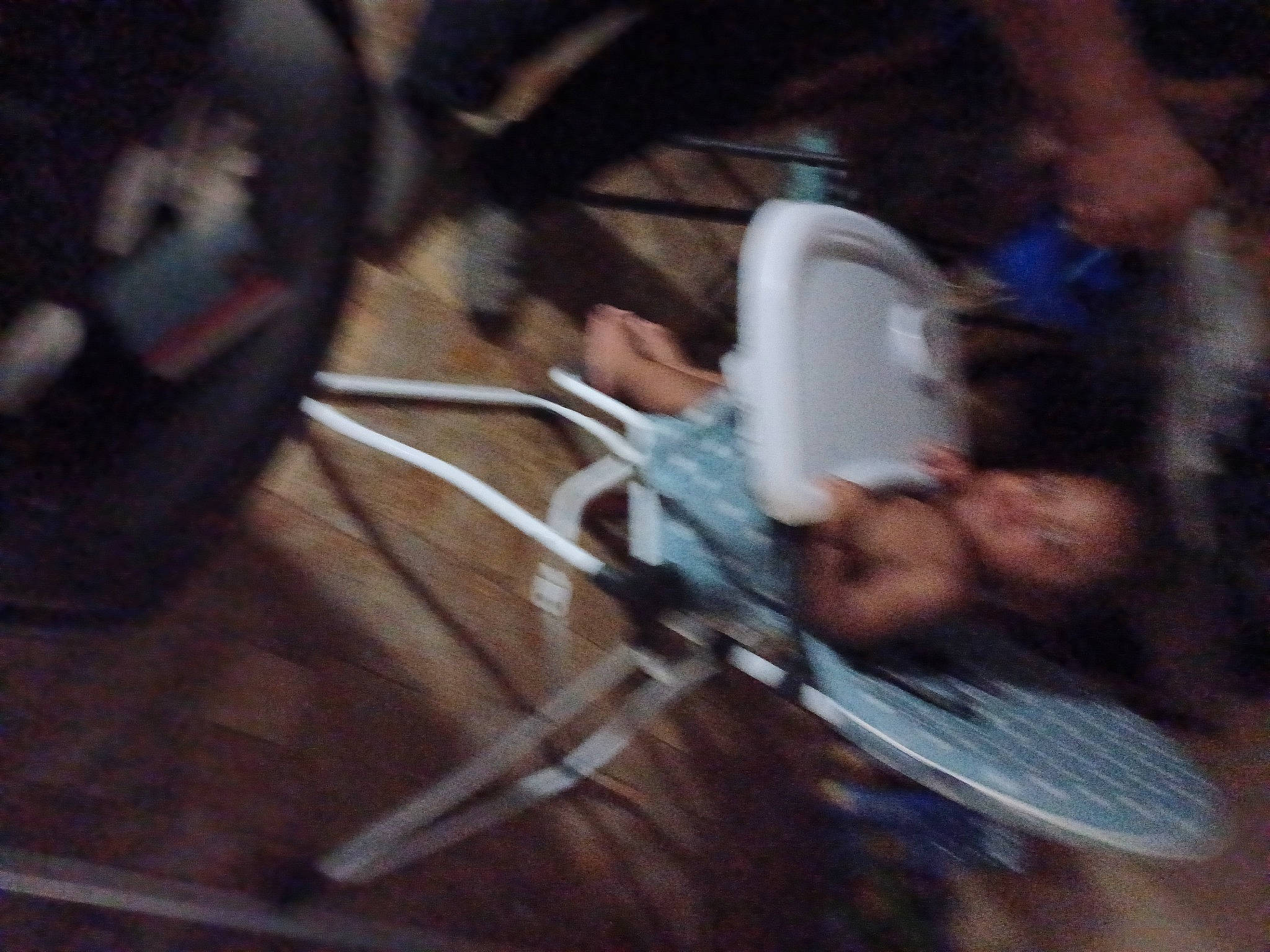 King is registered to the contest to win money with this photo: audio_equipment, cable, darkness, electrical_wiring, entertainment, event, flooring, fun, gadget, hardwood, hat, music, musical_instrument_accessory, musician, night, performing_arts, person, recreation, room, wire